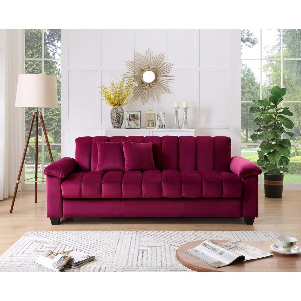 Canapé-lit convertible pour salon avec dossier cannelé et revêtement en tissu.