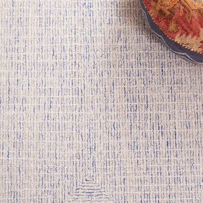 SAFAVIEH Handmade Abstract Maggy Modern Wool Rug