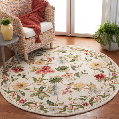 SAFAVIEH Handmade Chelsea Yauhenia French Country Floral Wool Rug