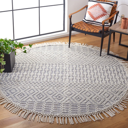 SAFAVIEH Handmade Natura Estel Wool Fringe Rug