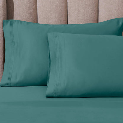 Jeu de draps uni en coton égyptien supérieur, 1000 fils, avec profonde poche.